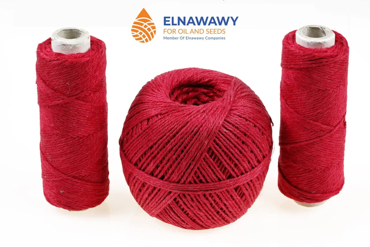 product of red flax yarn ball and hemp yarn spool