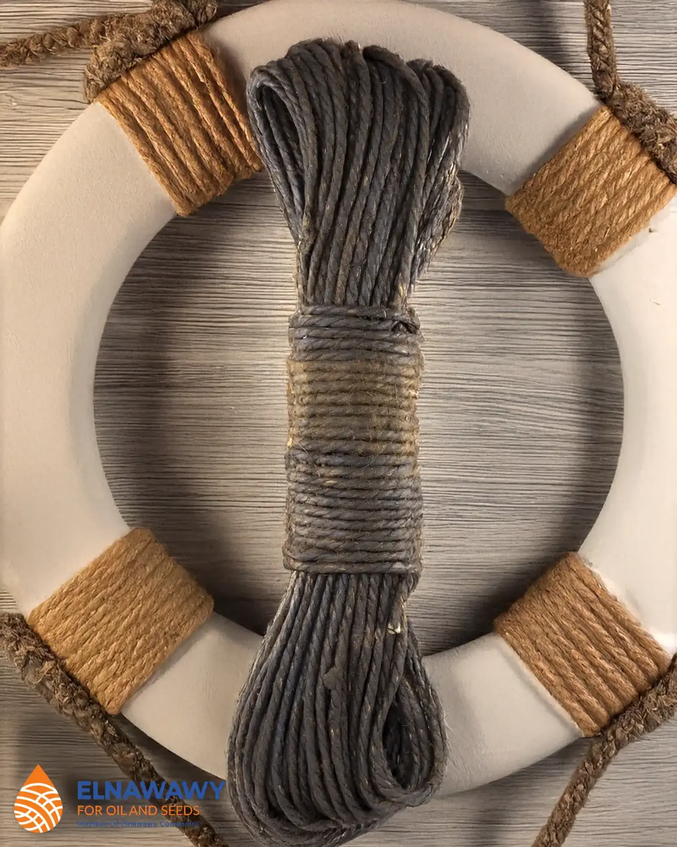 Tarred flax marline hank displayed with a lifebuoy in a nautical decoration setting